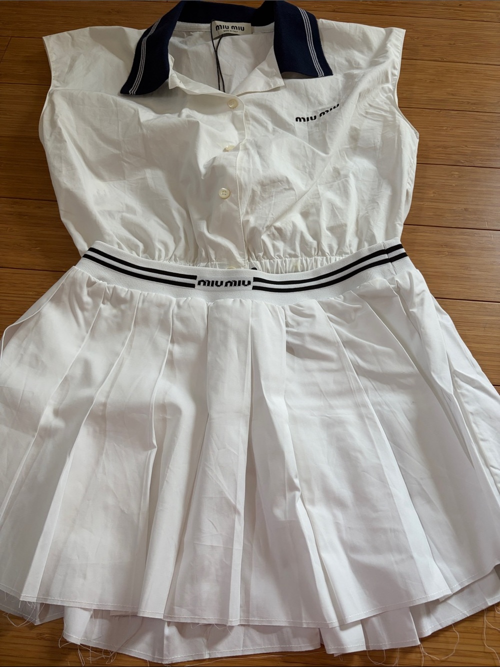 White Girls' Pleated Dress with Navy Collar and Black-Trim Waistband